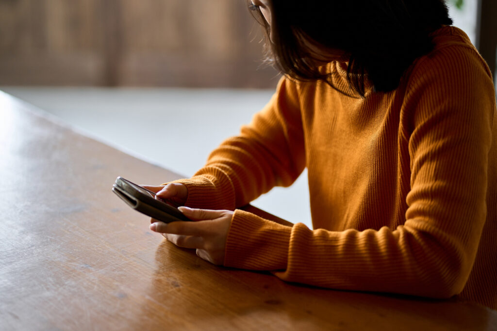 A woman looking at her smartphone.